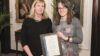 Dawn Connelly (right) receiving her Medical Journalists’ Association award for data journalism from Rosemary Hennings on behalf of Galliard Healthcare Communications
