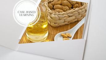 Photo of penuts in a basket and a bottle of oil