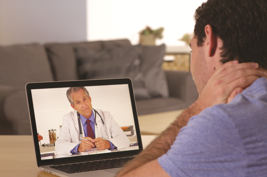Man using laptop to consult with doctor