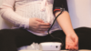 pregnant woman using blood pressure monitor at home