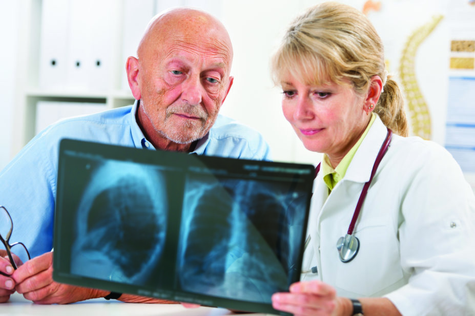 doctor explaining lung x-ray to patient