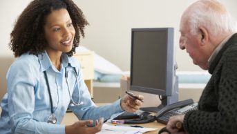 Female pharmacist in a consulation with an older person