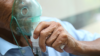 Person using an oxygen mask