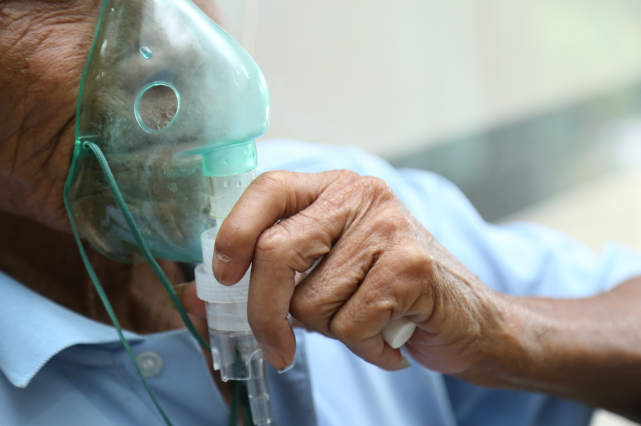 Person using an oxygen mask