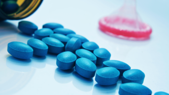 Blue sildenafil tablets on a table