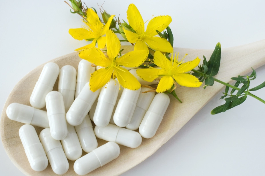 St Johns Wort yellow flower alongside capsules