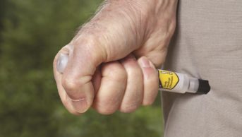 The European Medicines Agency (EMA) is recommending a raft of new measures to educate patients and carers on the proper use of adrenaline auto-injectors. In the image, a patient uses an adrenaline auto-injector