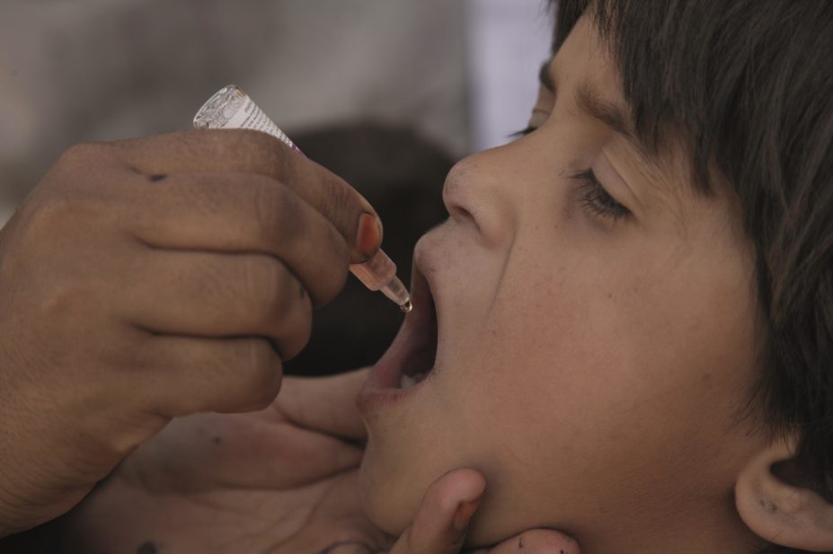 Afghan boy gets polio vaccination - number of deaths among children drops, says UN