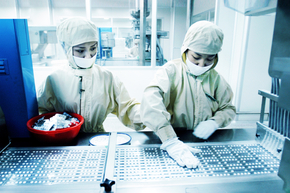 Workers in a Chinese drug manufacturing facility