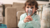 Toddler using an inhaler