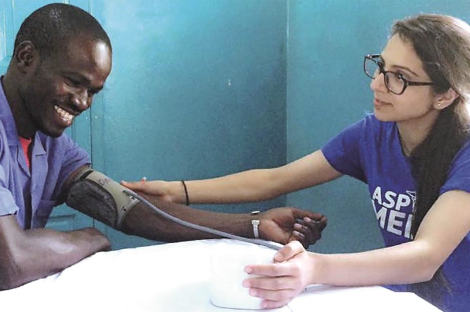 Baguiasri Mandane (right) takes the blood pressure of a practice nurse