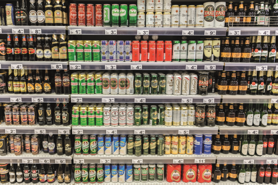 Beer cans in supermarket shelves