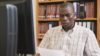 Black African university student studies in library