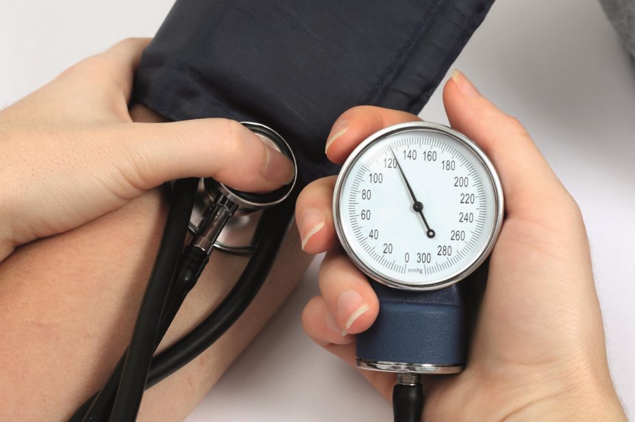 A major US study has found intensive treatment to a target of 120mmHg significantly improves cardiovascular outcomes compared with a target of 140mmHg, as recommended by NICE. In the image, close up of a doctor taking a patient's blood pressure