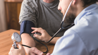 Doctor measuring a patient's blood pressure