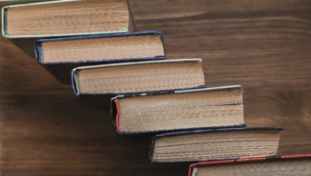 Books stacked forming staircase