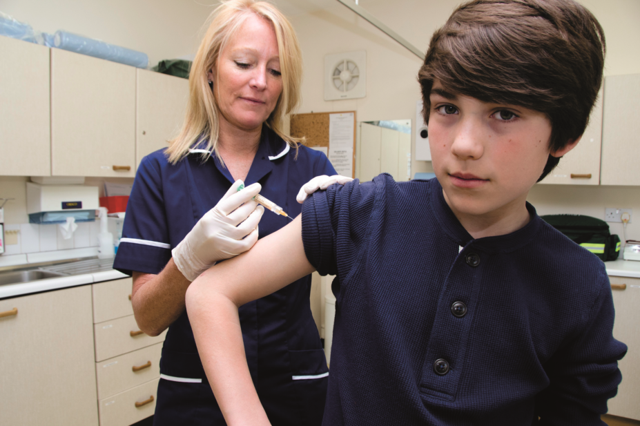 Boy receives human papilloma virus (HPV) vaccination