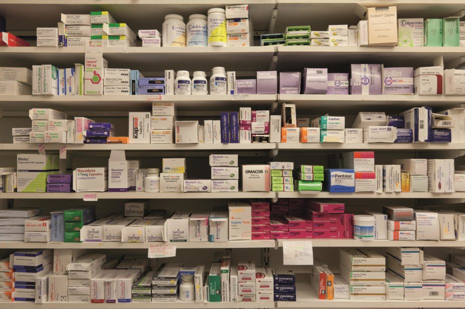 NHS spending on branded drugs made available under the Pharmaceutical Price Regulation Scheme (PPRS) between 2013 and 2014 went up by 5.2%, according to the Department of Health (DH). In the image, a shelf of branded drugs in a pharmacy dispensary