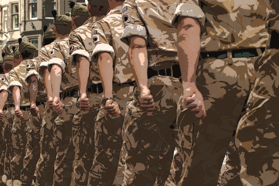 British Army servicemen in desert fatigues marching