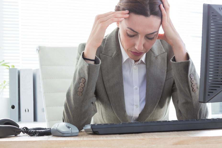 One in four people will experience a mental health problem in any year. In the workplace, one in six of British workers will experience a mental health problem such as anxiety, depression or stress every year. In the image, stressed businesswoman