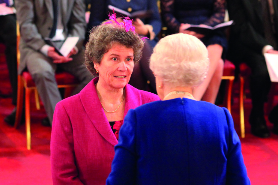 Celia Ingham Clark, new national patient safety director, NHS Improvement, speaks with Queen Elizabeth II after she receives an MBE