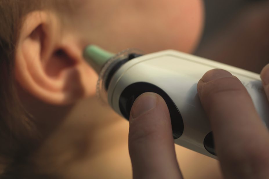 Fever in children is one of the most common clinical symptoms managed by healthcare providers. A child is usually regarded as having a fever if his or her temperature is 38○C or above. In the image, an adult holds a thermometer to a child’s ear