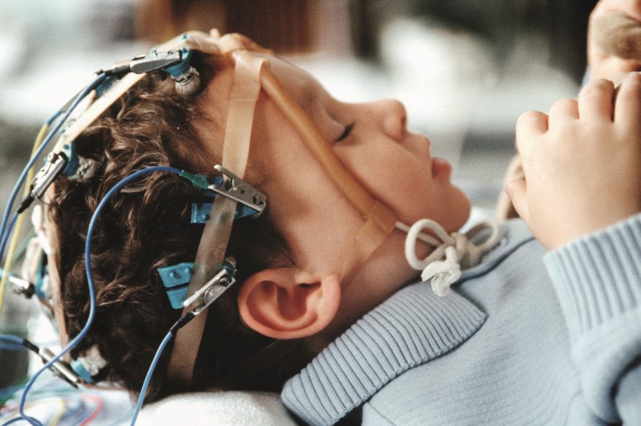 Toddler suffering from epilepsy undergoing electroencephalogram (EEG) examination