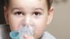 Study of more than 50,000 children shows prenatal exposure to paracetamol associated with 13% increased risk of asthma. In the image, close-up of a toddler using an inhaler