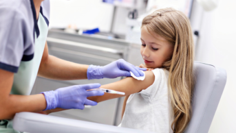 Child receiving vaccination