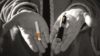 Hand holding a cigarette and an e-cigarette