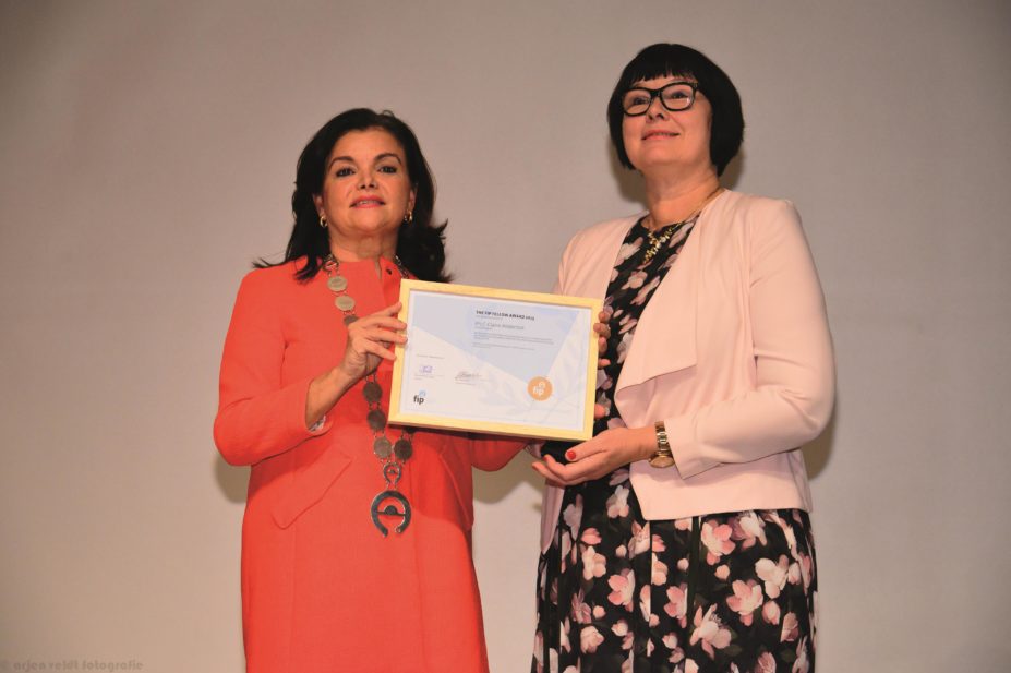 Claire Anderson receives FIP Fellowship at the opening ceremony of the International Pharmaceutical Federation annual congress