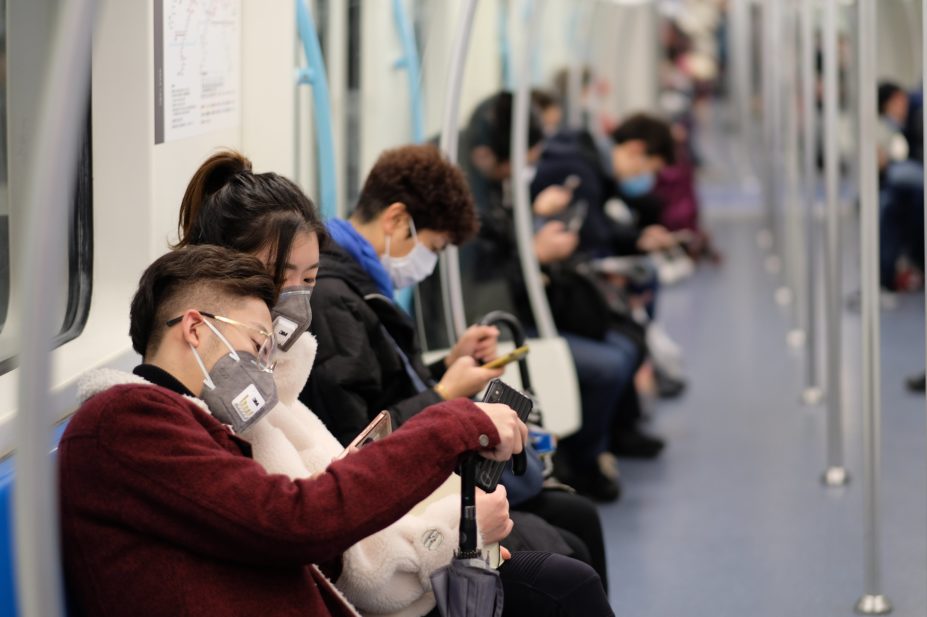 Chinese people on train wearing masks