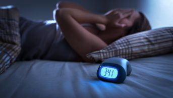 Woman unable to sleep in bed at night