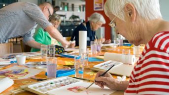 Older people painting together