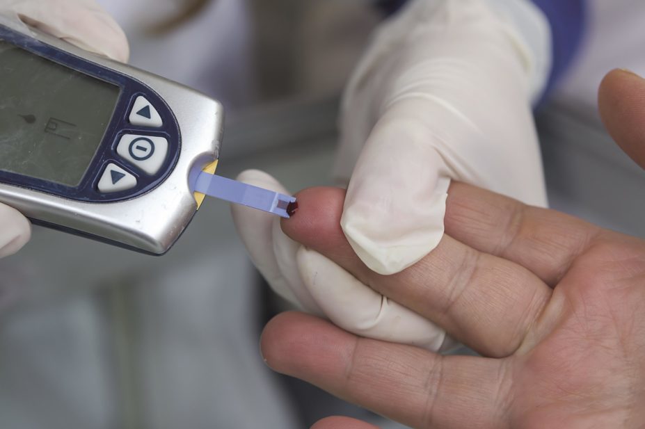 Close up of a pin prick blood glucose test