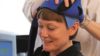 A cap, known as Dignicap, that cools the scalp to reduce hair loss (alopecia) in women undergoing chemotherapy for breast cancer has been cleared for marketing by the US FDA. In the image, a nurse puts a dignicap on a patient