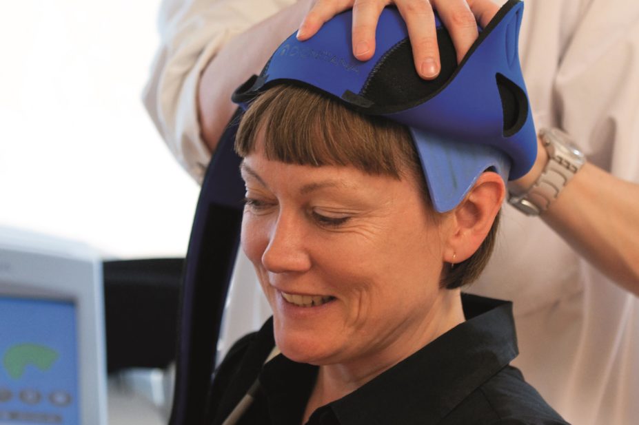 A cap, known as Dignicap, that cools the scalp to reduce hair loss (alopecia) in women undergoing chemotherapy for breast cancer has been cleared for marketing by the US FDA. In the image, a nurse puts a dignicap on a patient
