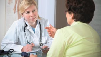 Patient consulting with doctor