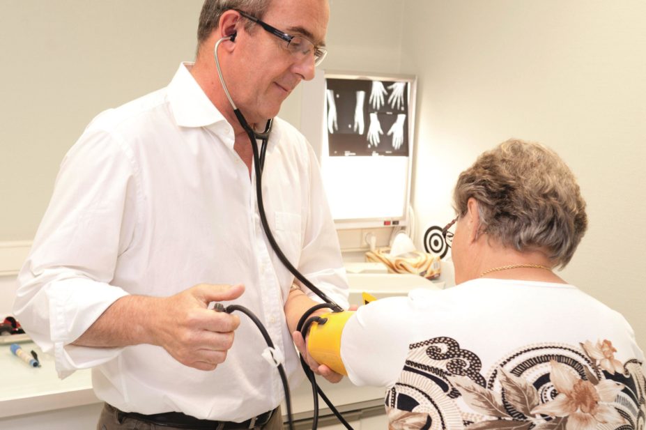 Gene variants that predict higher systolic blood pressure are associated with a higher probability of taking antihypertensive medication and with a decreased risk of Alzheimer's disease. In the image, a doctor tests a woman's blood pressure