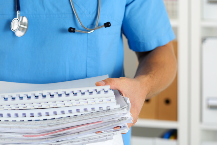 Doctor handling paperwork