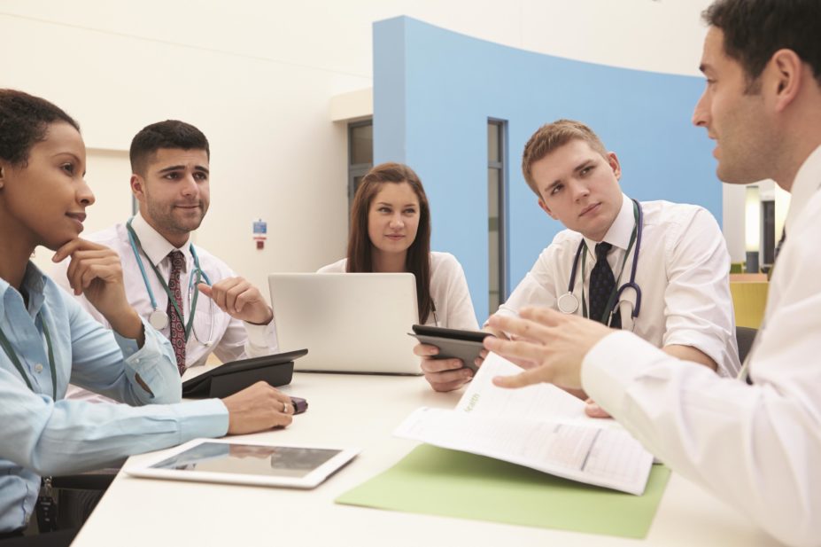 Pharmacy teams are often tasked with supporting other health professionals to optimise the way medicines are used. In the images, group of pharmacists and consultants in a meeting