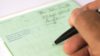Research is needed to determine how often prescribing indicators are triggered by clinical decisions as opposed to oversight or error.  In the image, close-up of a doctor filling out an NHS prescription pad