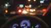 Blurred dashboard of the car indicating driving under the influence of drugs