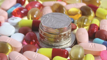 Pills and coins, drug prices