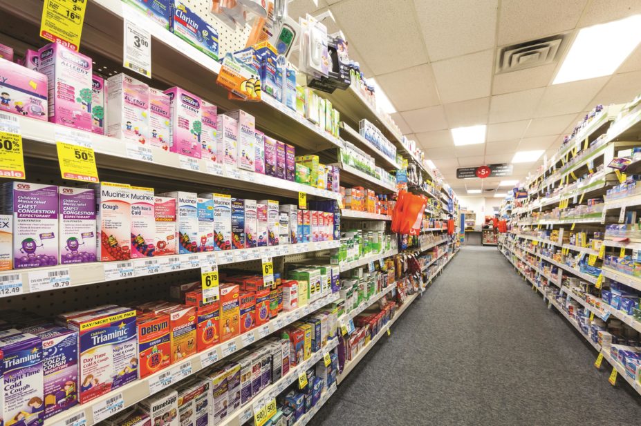 Aisle in drugstore with over-the-counter (OTC) medicines