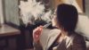 The Scottish government intends to regulate the sale of e-cigarettes and restrict their advertising as part of proposals outlined in the Health (Tobacco, Nicotine etc and Care) (Scotland) Bill. In the image, a woman smokes an e-cigarette