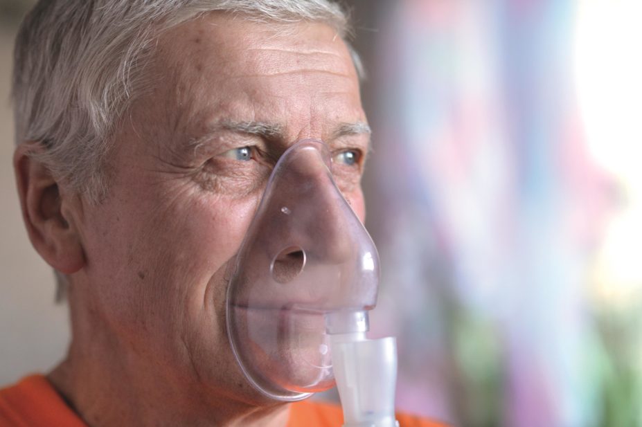 Iron deficiency is more common in patients with chronic obstructive pulmonary disease (COPD) than in those without the lung condition. In the image, an elderly man breathes into an oxygen mask