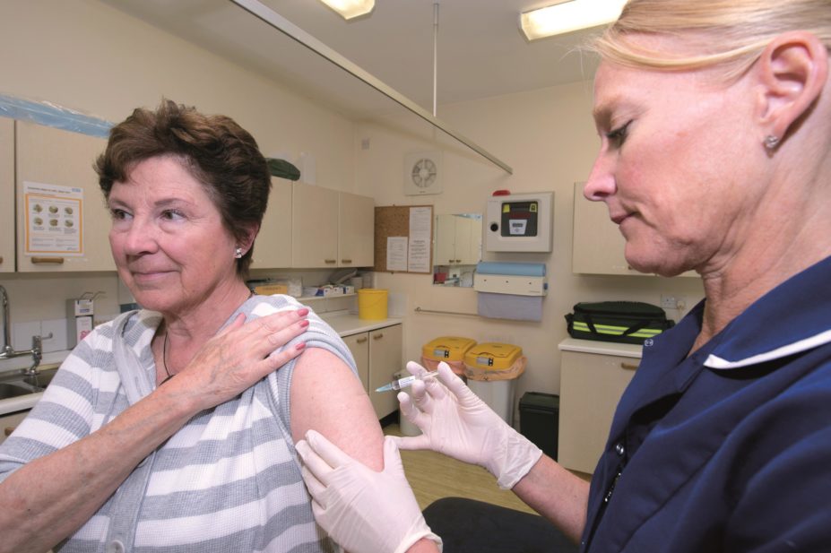 The number of 70 year olds in England routinely vaccinated against shingles in 2014/15 dropped by 3% compared with the previous 12 months, Public Health England reveals. In the image, an elderly woman gets the shingles vaccine