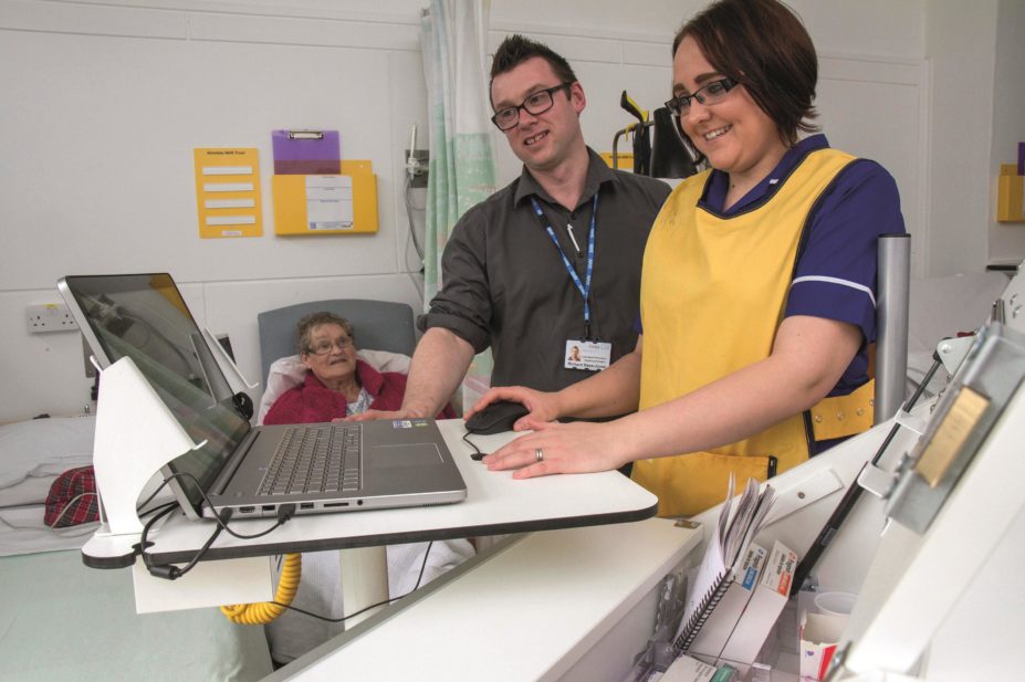 Hospital staff at Airedale NHS Foundation Trust use the new electronic prescribing system on the drugs round