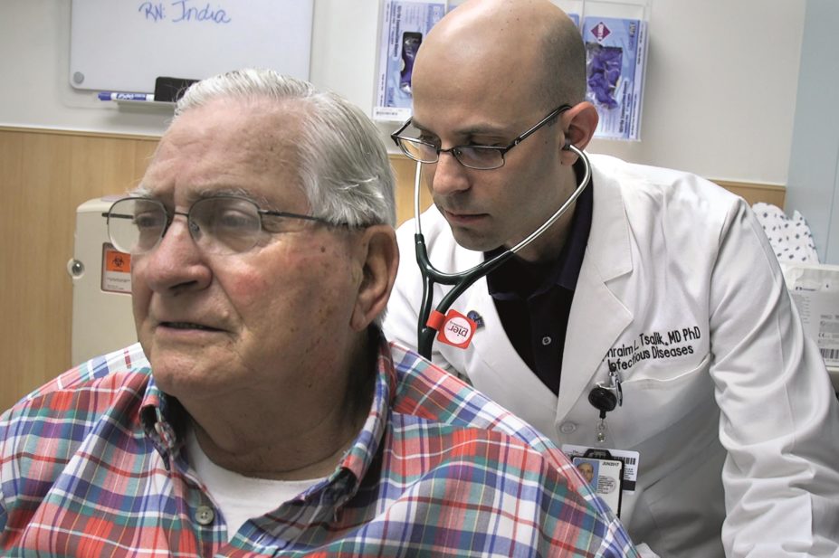 Dr. Ephraim Tsalik, pictured, one of the authors of the study evaluating a patient with respiratory illness